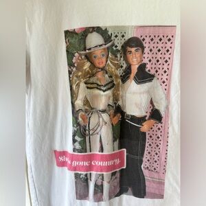 Barbie she’s gone country white T shirt, size small, pink rhinestones